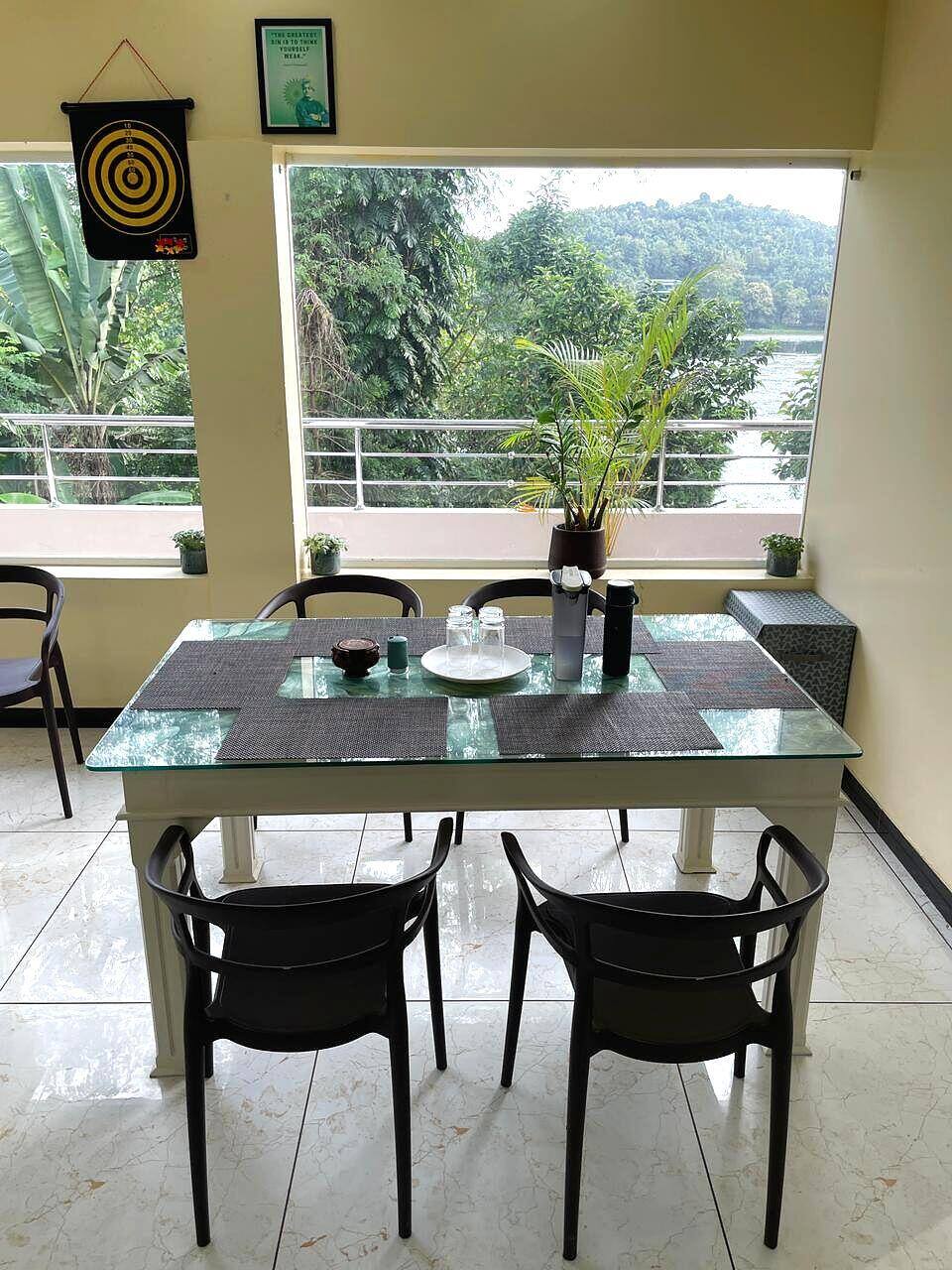 Breakfast table with a full view of Poomala Dam